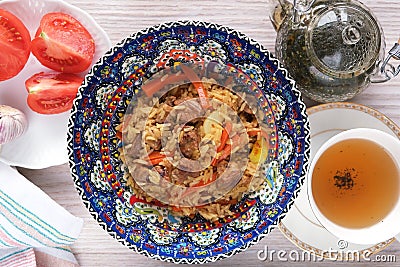 Ã‚Â Asian pilaf in original plate Stock Photo